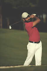 Image showing golfer hitting a sand bunker shot