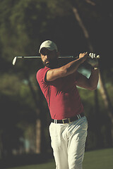 Image showing golfer hitting a sand bunker shot