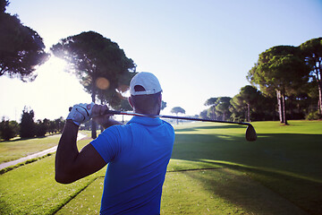 Image showing golf player hitting shot