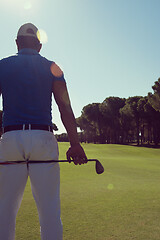 Image showing golf player portrait from back