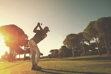 Image showing golf player hitting shot with club