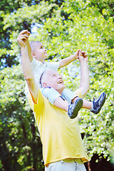 Image showing happy grandfather and child in park