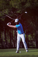 Image showing golf player hitting shot