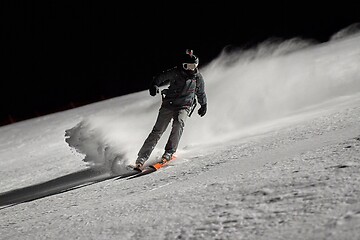 Image showing Skiing in the winter snowy slopes at night