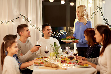 Image showing happy family having dinner party at home