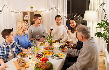 Image showing happy family having dinner party at home