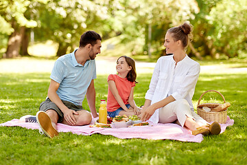 Image showing happy family having picnic at summer park