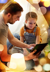 Image showing family with tablet pc in kids tent at home