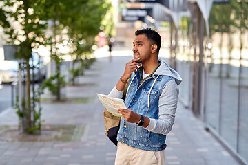 Image showing indian man traveling with backpack and map in city