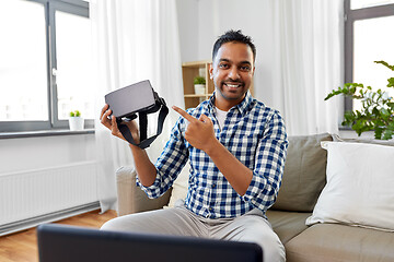 Image showing male blogger with vr glasses videoblogging at home