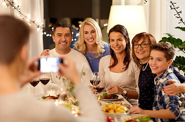 Image showing family having dinner party and taking selfie