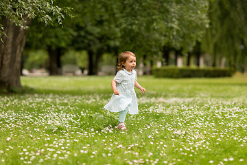 Image showing happy little baby girl running at park in summer