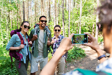 Image showing friends with backpacks being photographed on hike