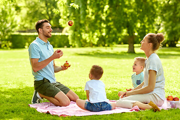 Image showing happy family having picnic at summer park