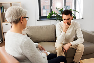 Image showing senior woman psychologist and sad man patient