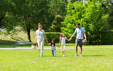 Image showing family with picnic basket walking in summer park