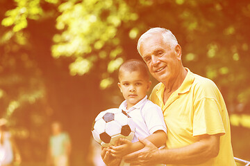 Image showing grandfather and child have fun  in park