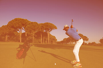 Image showing golf player hitting shot