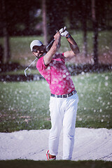 Image showing golfer hitting a sand bunker shot