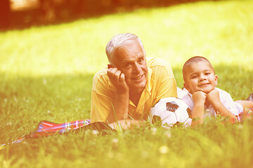 Image showing grandfather and child have fun  in park