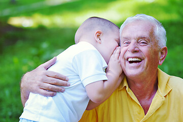 Image showing happy grandfather and child in park