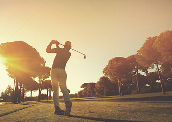 Image showing golf player hitting shot with club