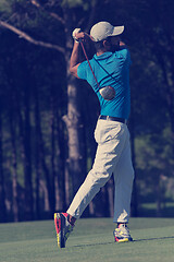 Image showing golf player hitting long shot