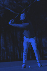 Image showing golf player hitting shot