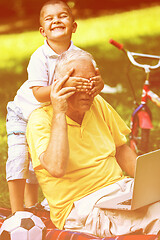 Image showing grandfather and child have fun  in park