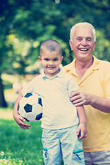 Image showing grandfather and child have fun  in park