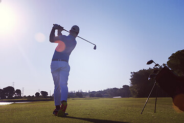 Image showing golf player hitting long shot