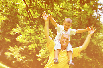 Image showing happy grandfather and child in park