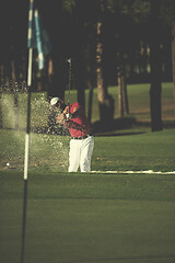 Image showing golfer hitting a sand bunker shot