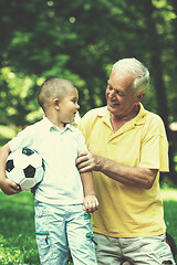 Image showing grandfather and child have fun  in park