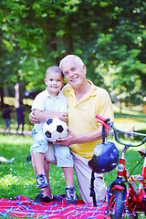 Image showing happy grandfather and child in park