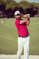 Image showing golfer hitting a sand bunker shot