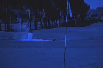 Image showing golfer hitting a sand bunker shot