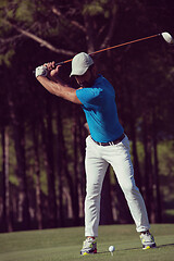 Image showing golf player hitting shot