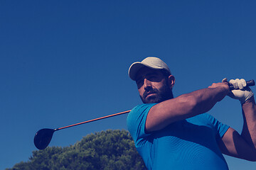 Image showing golf player hitting shot