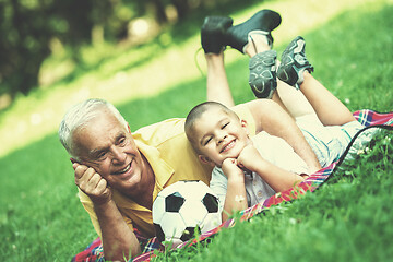 Image showing grandfather and child have fun  in park