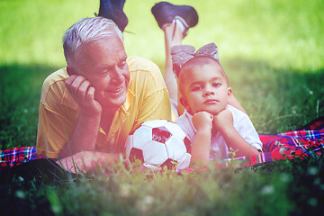 Image showing grandfather and child have fun  in park