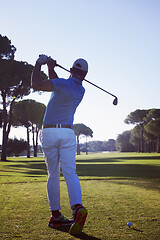 Image showing golf player hitting shot