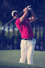 Image showing golfer hitting a sand bunker shot