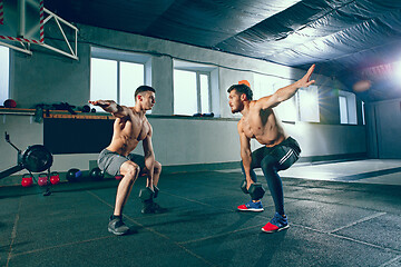 Image showing Athletic man doing exercise for arms.