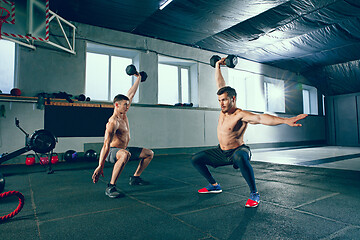 Image showing Athletic man doing exercise for arms.