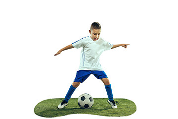 Image showing Young boy kicks the soccer ball