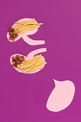 Image showing I love fast food. French fries in the form of is kidneys isolated on pink background