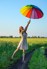 Image showing girl with a multicolored umbrella