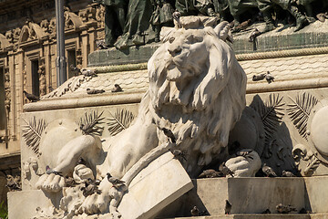 Image showing Lion statue and doves near cathedral