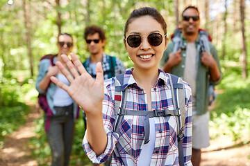 Image showing friends with backpacks on hike in forest